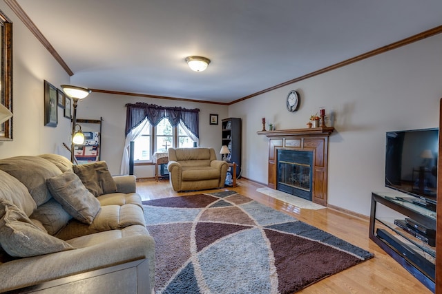 living room with ornamental molding and hardwood / wood-style floors