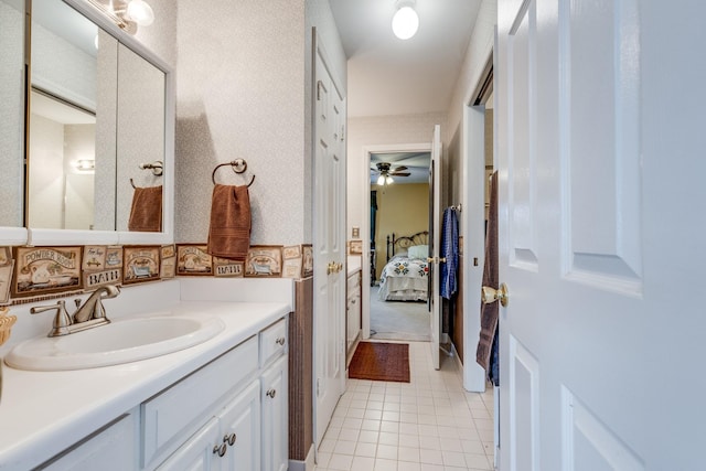 bathroom featuring vanity, tile patterned floors, ceiling fan, and decorative backsplash