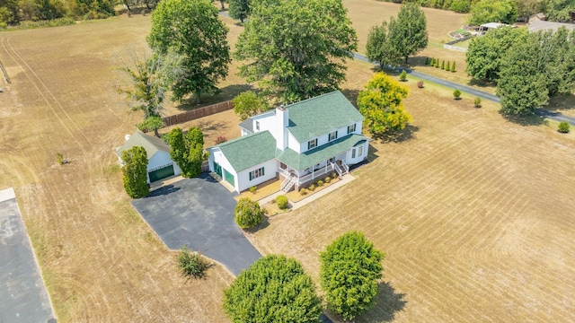 birds eye view of property with a rural view