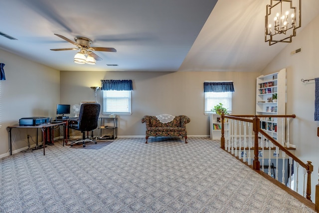 office with lofted ceiling, ceiling fan with notable chandelier, carpet floors, and plenty of natural light