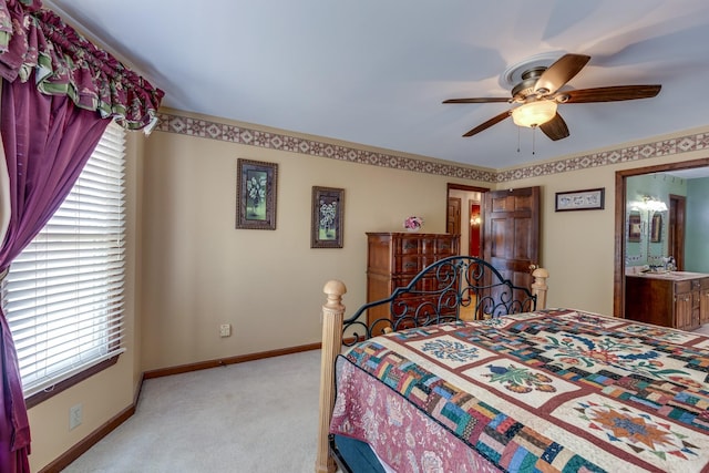 carpeted bedroom featuring connected bathroom and ceiling fan