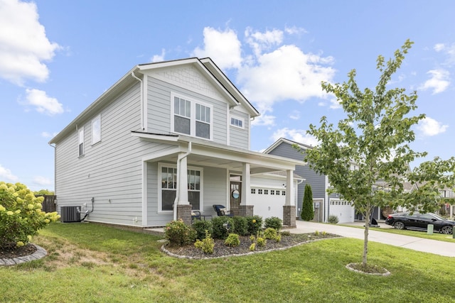 craftsman-style house featuring covered porch, a front yard, and central air condition unit