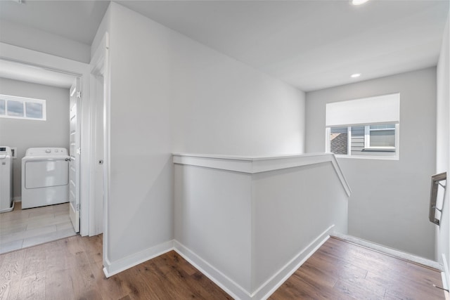 hallway featuring hardwood / wood-style flooring and washer and clothes dryer