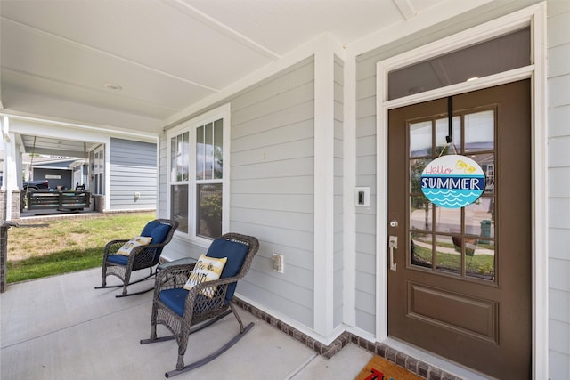 doorway to property featuring a porch