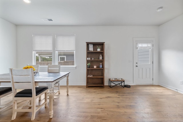 dining area with hardwood / wood-style flooring