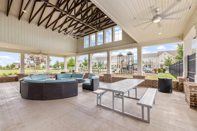 view of patio / terrace featuring a playground, outdoor lounge area, and ceiling fan