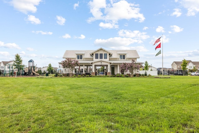 view of front of property with a playground and a front lawn