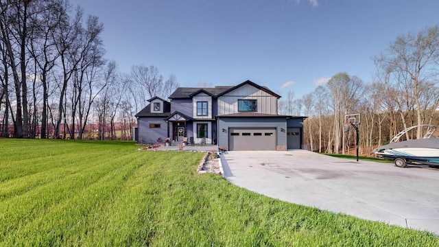 view of front of property with a front yard and a garage