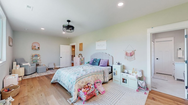 bedroom with light wood-type flooring