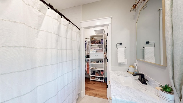 bathroom with tile patterned flooring and vanity