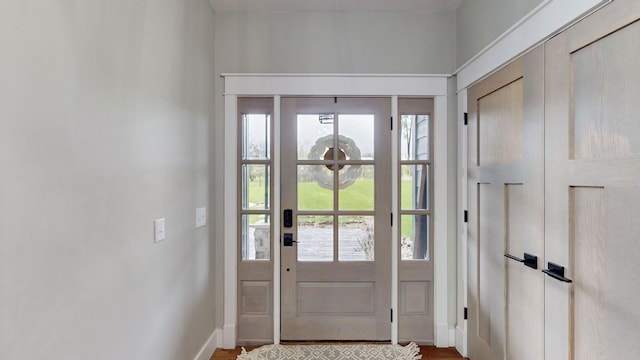 entryway with hardwood / wood-style flooring