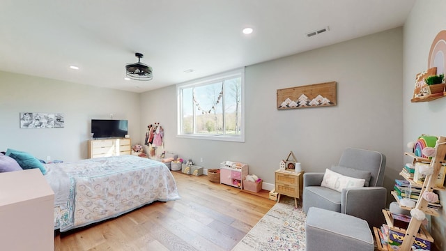 bedroom with light hardwood / wood-style flooring