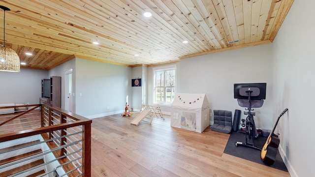 interior space with light hardwood / wood-style flooring, crown molding, and wood ceiling