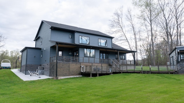 rear view of property featuring a yard and a patio