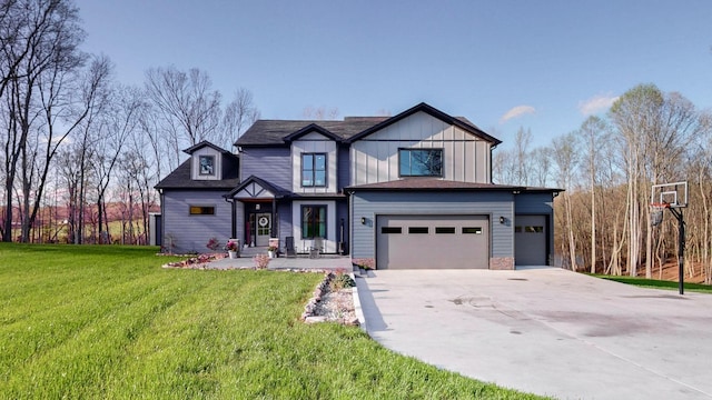 view of front of property with a front lawn and a garage