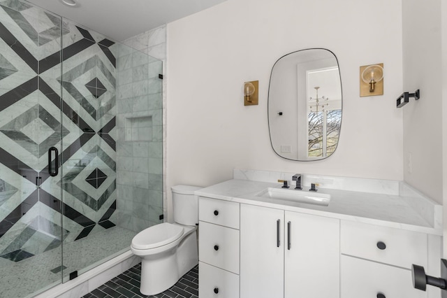 bathroom featuring tile patterned floors, toilet, an enclosed shower, and vanity