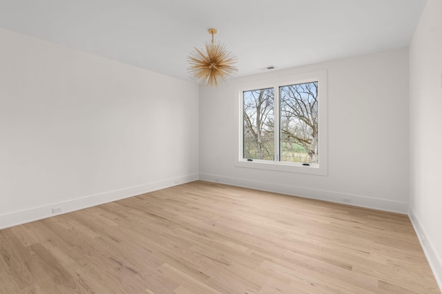 unfurnished room featuring light wood-type flooring