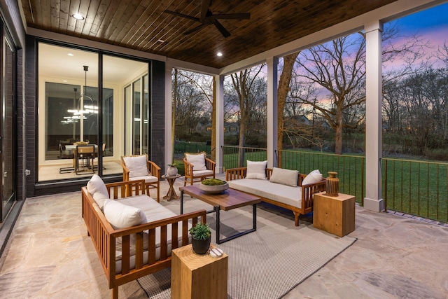 sunroom with wood ceiling and ceiling fan with notable chandelier