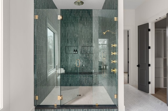 bathroom with a shower with shower door