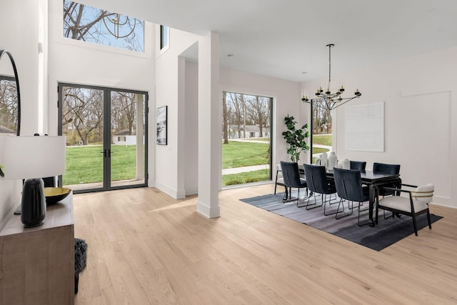 dining room featuring a chandelier and light hardwood / wood-style flooring