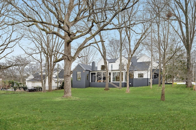 view of yard with a sunroom