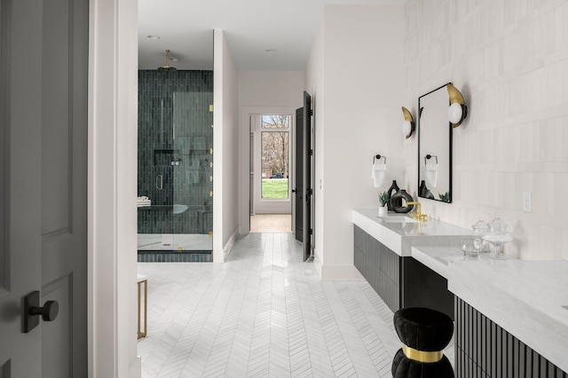 bathroom featuring vanity and an enclosed shower