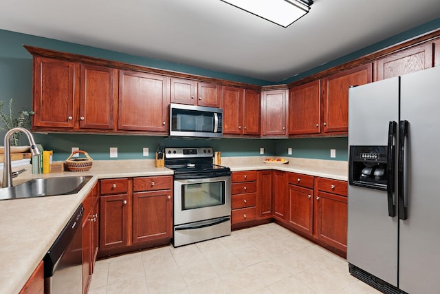 kitchen with sink and appliances with stainless steel finishes