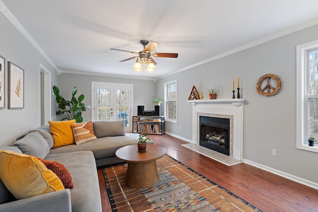 living room with ceiling fan, french doors, dark hardwood / wood-style floors, and ornamental molding