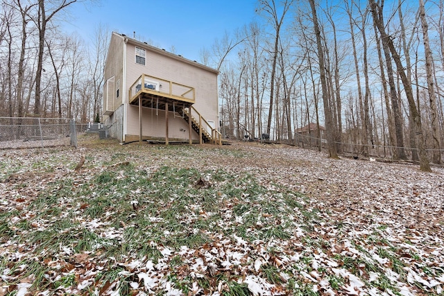 rear view of property with a wooden deck