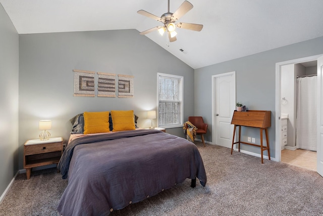 bedroom featuring carpet, ceiling fan, lofted ceiling, and connected bathroom