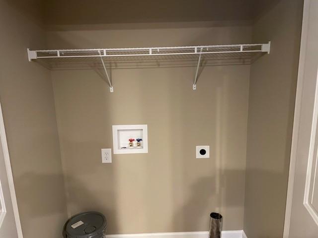 washroom with hookup for a washing machine and electric dryer hookup