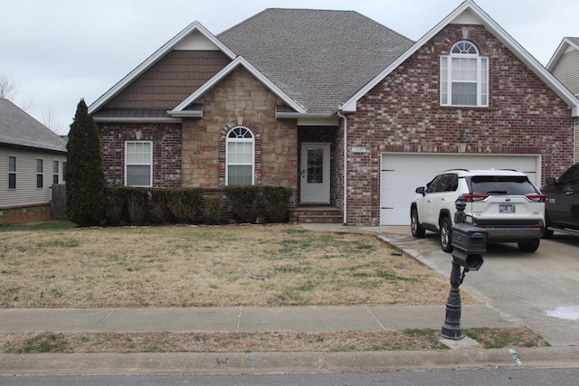 view of front facade with a garage and a front lawn