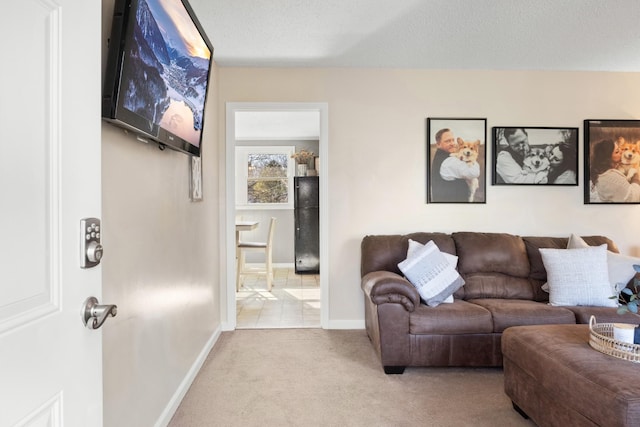 carpeted living room with a textured ceiling