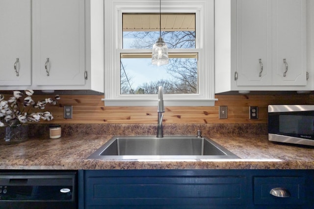 kitchen featuring white cabinetry, sink, blue cabinetry, and dishwasher