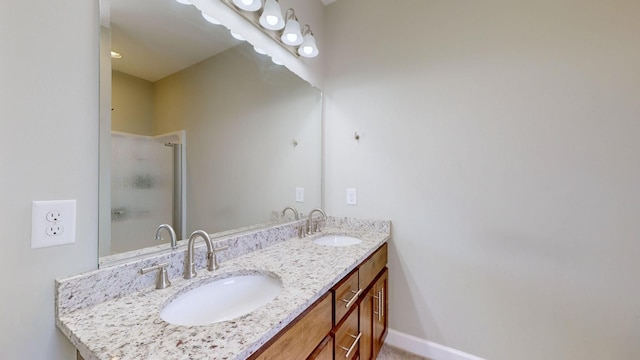 bathroom with vanity and a shower with shower door