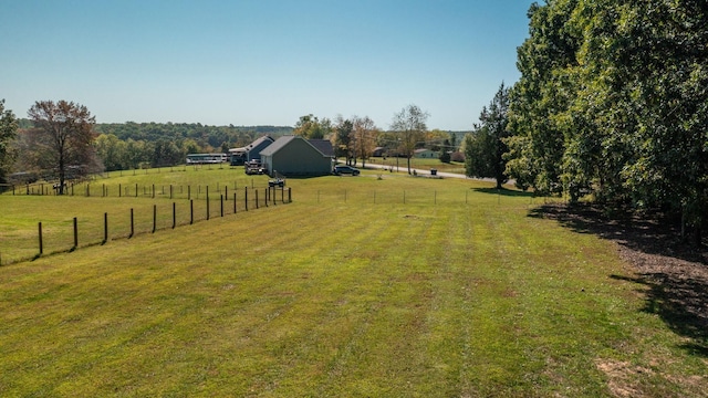 view of yard with a rural view