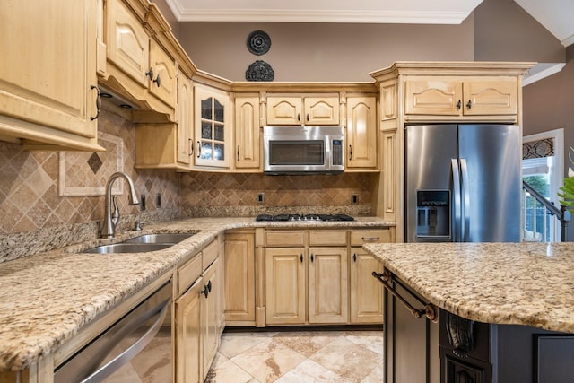 kitchen with light brown cabinetry, backsplash, ornamental molding, stainless steel appliances, and sink