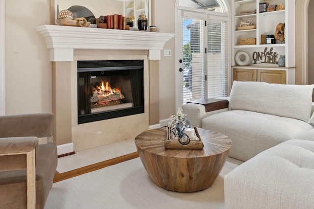 living area with hardwood / wood-style flooring