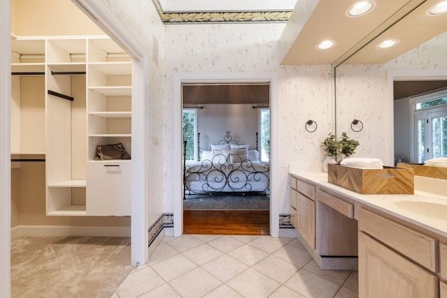 bathroom featuring tile patterned flooring, vanity, built in features, and plenty of natural light