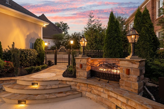 view of patio terrace at dusk