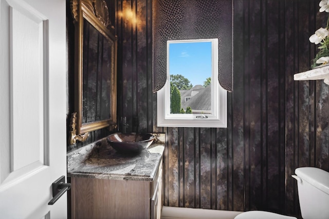 bathroom featuring vanity and toilet