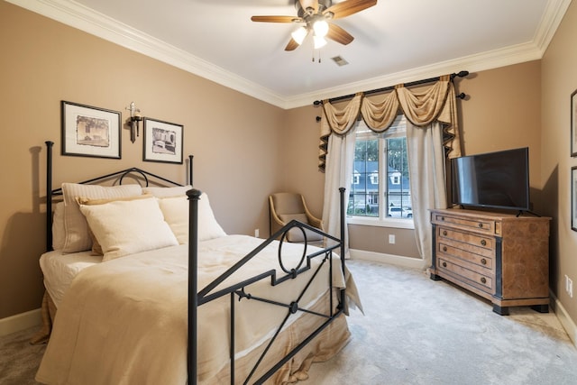 carpeted bedroom with ceiling fan and crown molding