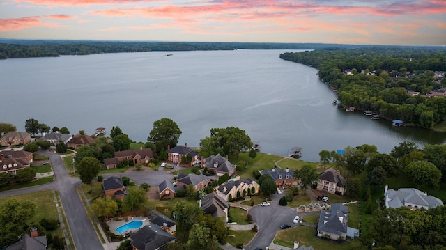 aerial view at dusk with a water view