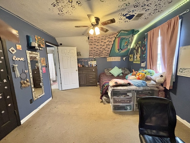 bedroom featuring ceiling fan, light colored carpet, lofted ceiling, and a textured ceiling