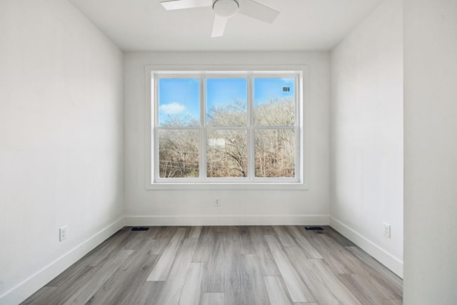 unfurnished room featuring light hardwood / wood-style floors and ceiling fan