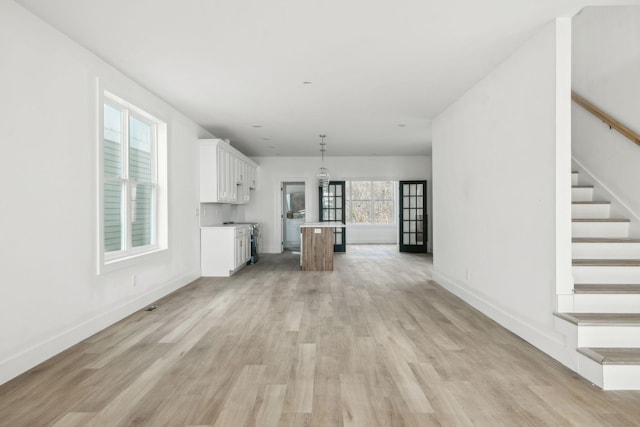 unfurnished living room featuring light hardwood / wood-style flooring