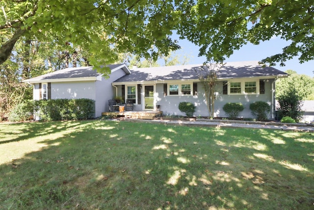 ranch-style home with a front lawn