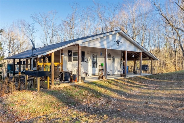 view of front of house with a patio area