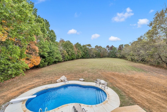 view of pool featuring a diving board