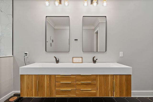 bathroom featuring vanity, tile patterned floors, and crown molding